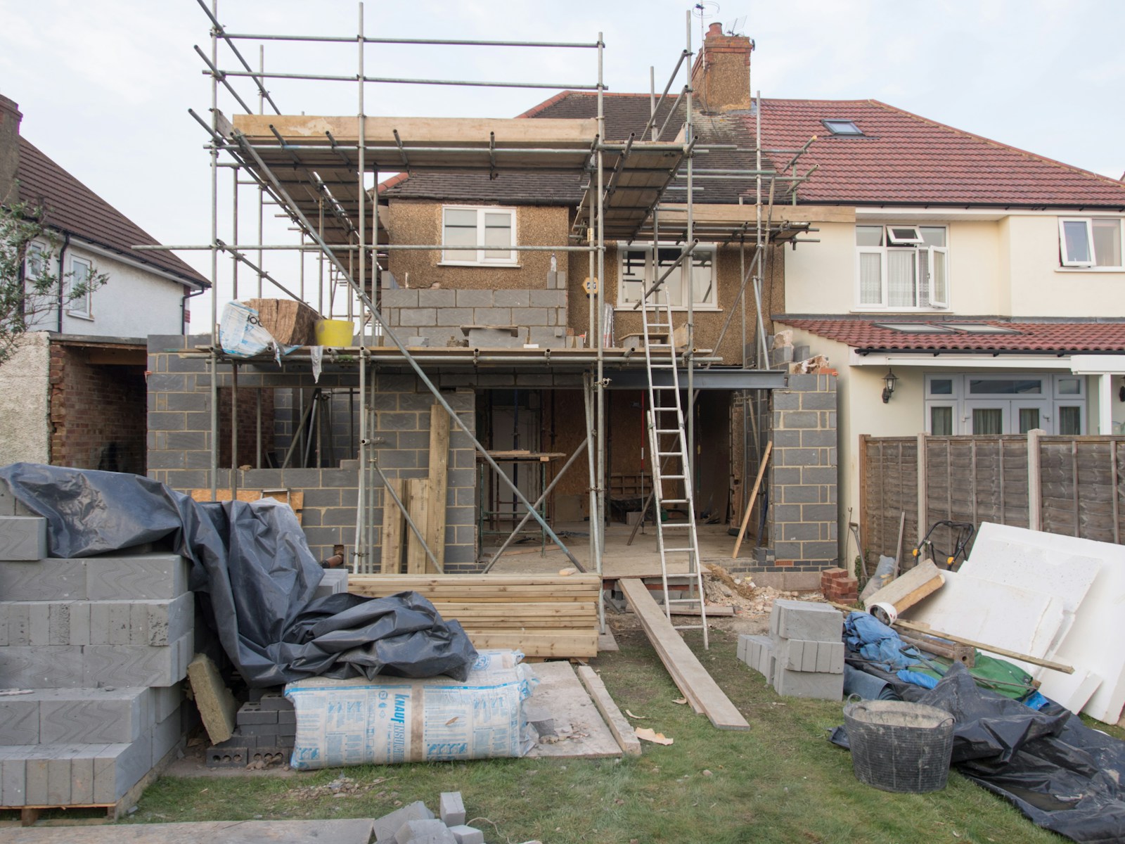 Block walls and reinforcement on a bungalow under construction, illustrating the cost of building a 3-bedroom bungalow in Nigeria in 2026