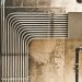 Surface electrical conduit and wiring on a concrete wall during a house installation, illustrating wiring costs in Nigeria in 2026