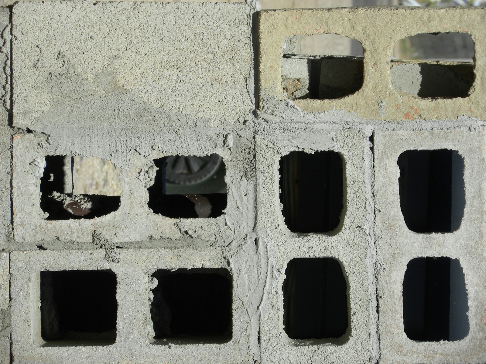 Stacked cement blocks, used to estimate how many blocks build a 3-bedroom bungalow in Nigeria