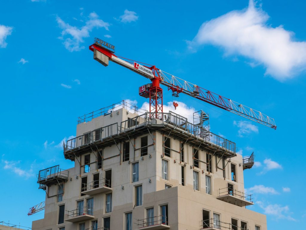 Crane beside a building under construction, representing Lagos building approvals going fully online
