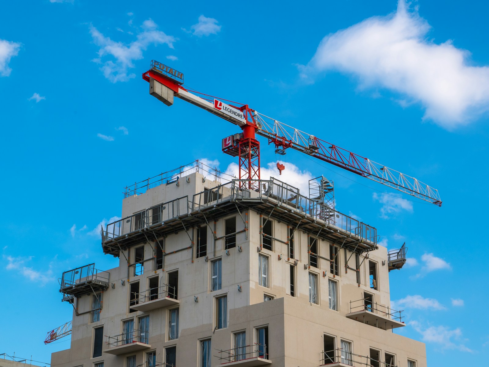 Crane beside a building under construction, representing Lagos building approvals going fully online