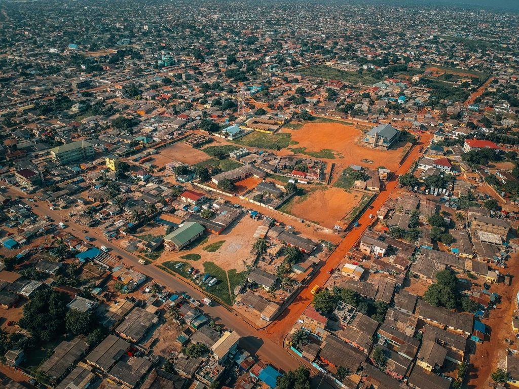 Aerial view of a dense West African residential housing estate, illustrating Nigeria's FMBN mortgage ceiling increase in 2026