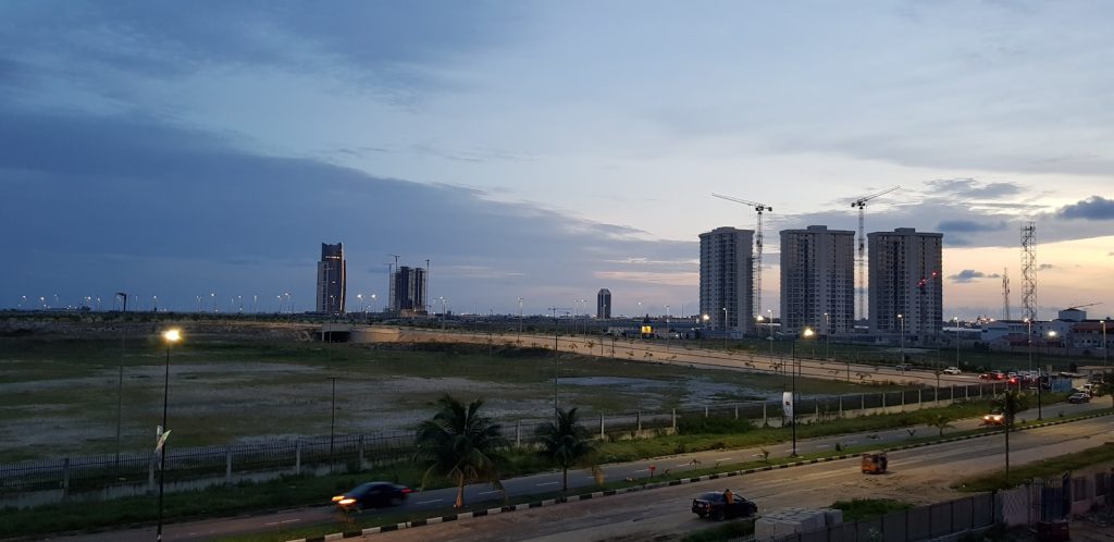 Residential buildings along a road on the Lagos mainland, Nigeria, where 3-bedroom flats stay affordable in 2026