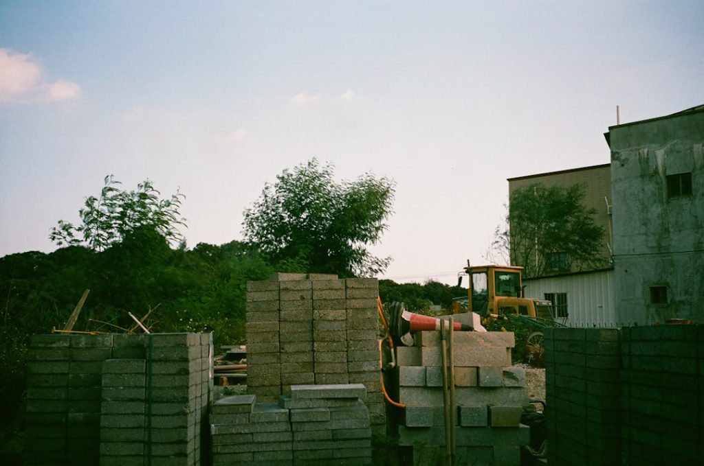 Stack of grey sandcrete blocks at a Nigerian building site for a 3-bedroom bungalow