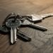 House keys resting on a signed property document, illustrating Certificate of Occupancy costs in Nigeria