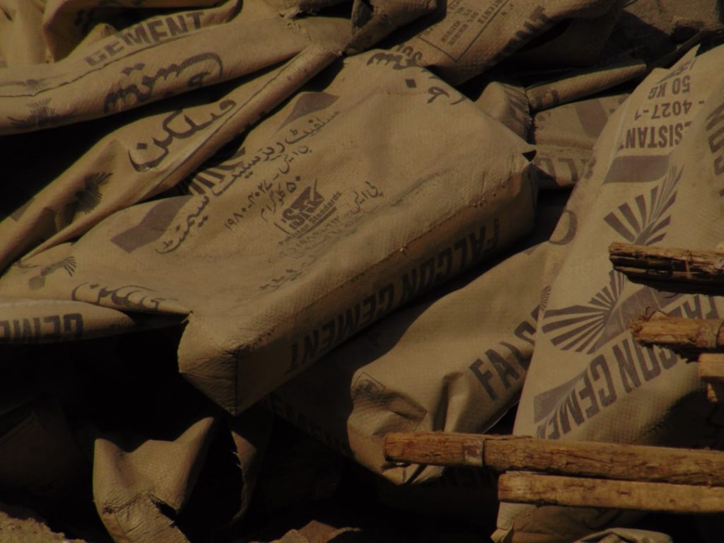 Stacked 50kg bags of cement in a Nigerian building-materials store as prices rise in 2026