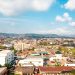 Aerial view of Enugu, the Coal City, Nigeria, showing residential rooftops among green hills, 2026