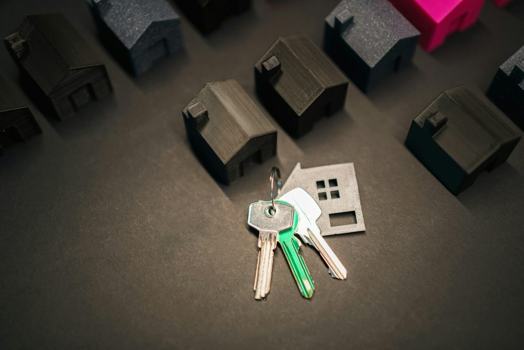 A house key and model home representing FMBN's 2026 diaspora NHF mortgage for Nigerians abroad