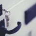 A key in a white apartment door, illustrating Lagos rent and tenancy rule changes for tenants and landlords in 2026