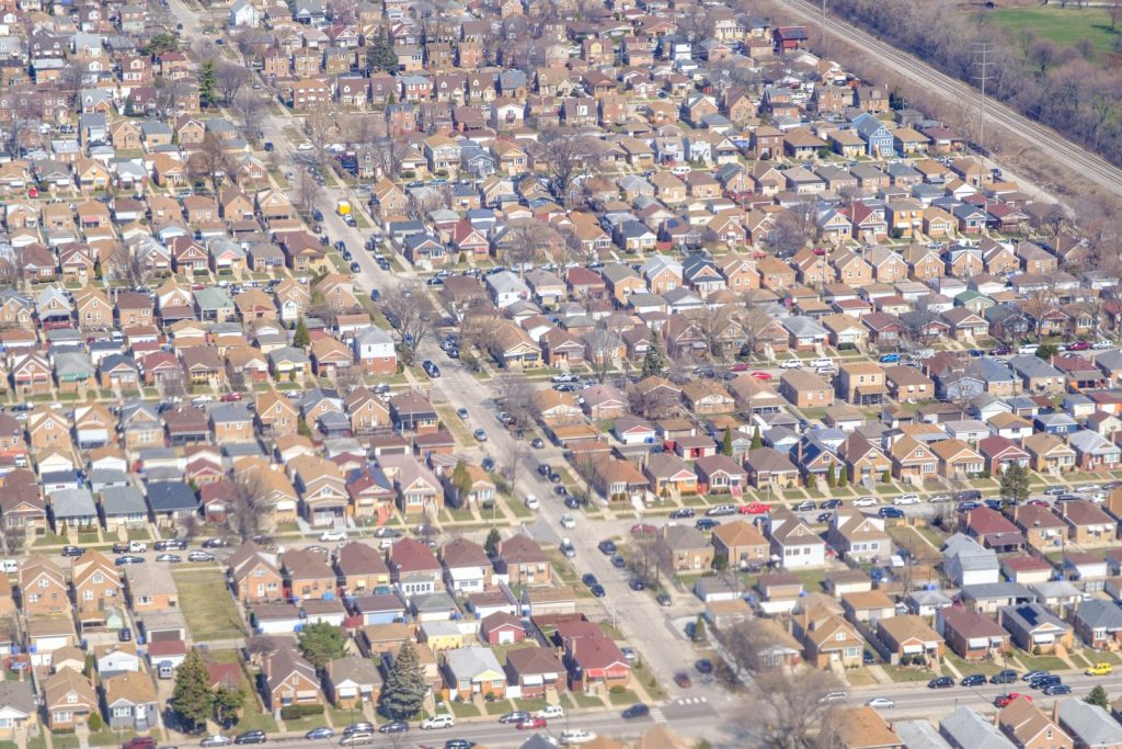 Aerial view of tightly packed houses, illustrating Nigeria's new building-level digital postcode system arriving in 2026