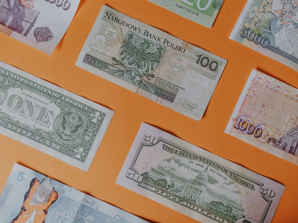 A spread of banknotes representing squeezed Nigerian household budgets as buyers delay home purchases in 2026