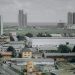 Tall residential buildings under an overcast Lagos sky as analysts warn of a possible property price correction in 2026