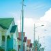 Rows of houses along a residential street in Nigeria, representing Renewed Hope affordable housing units selling in Lagos and Abuja in 2026