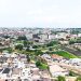 Aerial view of a developing Nigerian city skyline representing top real estate investment hotspots in 2026